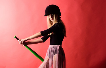 Woman enjoy play baseball game. Girl tender blonde wear helmet hold baseball bat red background. Woman in baseball sport. Baseball female player concept. Gentle but aptly. Kick off. Focused on result
