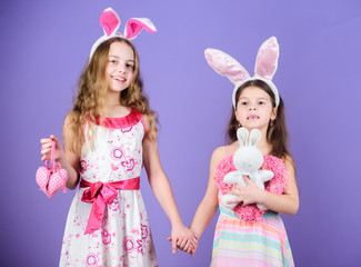 Playful girls sisters celebrate easter. Spring holiday. Happy childhood. Easter day. Easter activities for children. Happy easter. Holiday bunny girls with long bunny ears. Children bunny costume