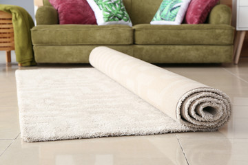 Rolled carpet on floor in room