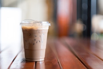 Iced mocha coffee with on wooden table