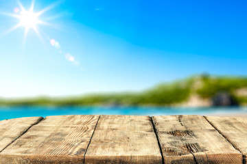 Desk of free space and summer sea landscape 