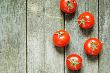 Fresh tomatoes on rustic wooden background - Image