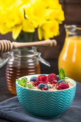 Muesli in bowl with fresh berry fruits