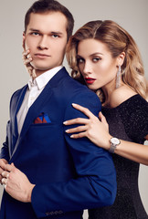 Sensual beautiful young couple dressed in formal clothes