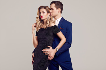 Sensual beautiful young couple dressed in formal clothes