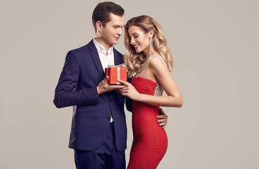 sensual beautiful young couple dressed in formal clothes