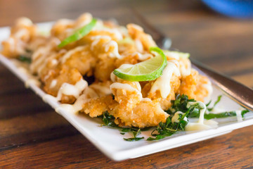 fried chicken with sour sweet sauce and fresh salad