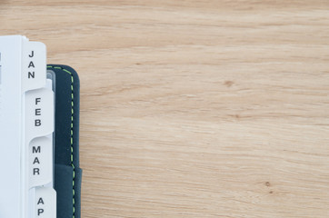 Diary quarter on a wooden table