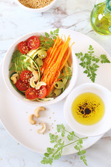 Vegetarian cuisine: raw zucchini and carrot spaghetti salad
