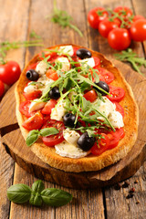 bruschetta with tomato, mozzarella and basil