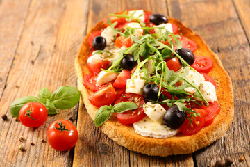 bruschetta with tomato, mozzarella and basil