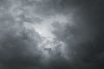 Storm clouds in the sky over the city. Gray gloomy sky before hurricane