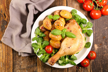 grilled duck leg with lettuce and potato