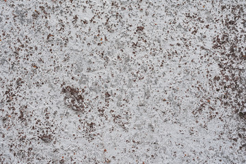 Wall fragment with scratches and cracks