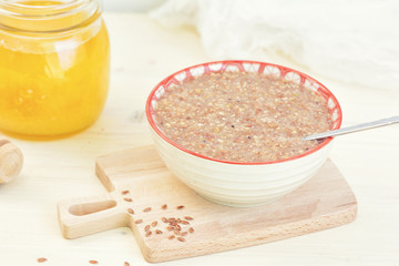 Tasty porridge from flax seeds with honey. Healthy vegetarian breakfast. Healthy food.