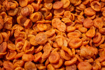 Dried apricots are on the counter of the store