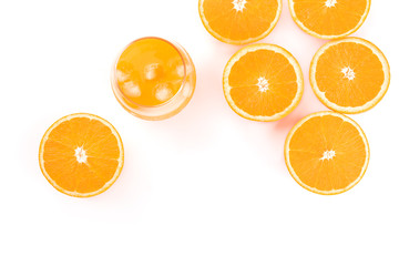 A glass of fresh orange juice with orange halves, shot from the top on a white background with copy space