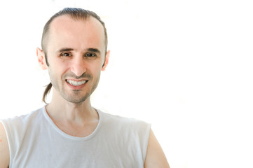 Obraz premium Happy brunet man with white shirt smiling on white background
