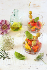 Appetizer. Vegetable salad: roasted tricolor bell pepper with olive oil and garlic, two verrines