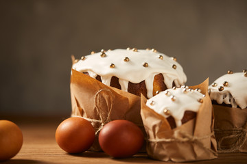 painted chicken eggs and delicious easter cakes decorated with frosting and sprinkles