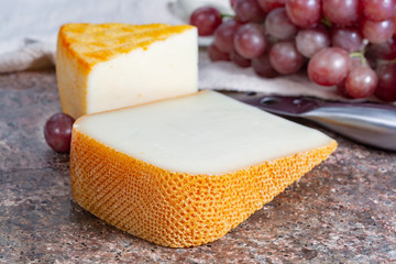 French yellow cheeses, Pur Brebis sheep melk cheese fron Pyrenees and Saint Paulin creamy, mild, semi-soft French cheese from pasteurized cow milk
