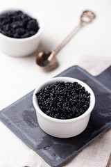 Sturgeon black caviar in bowls
