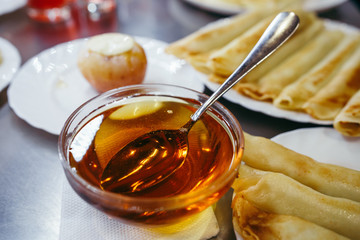 Pancakes with cheese are served with honey