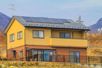 Solar power panels on the roofs,Photovoltaic modules for innovation green energy for life with blue sky background.