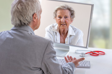 Telemedicine or telehealth concept, Doctor on the computer laptop screen and patient conferencing on treatment