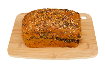 Fresh bread on wooden cutting board isolated on white background