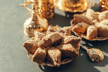 Turkish sweets with coffee on a wooden table