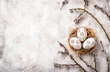 Easter background with willow and eggs