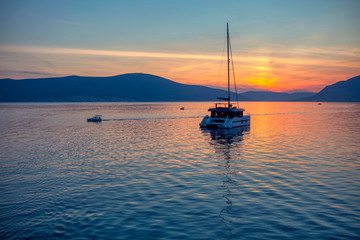 Fototapeta premium sailing on modern yacht in the twilight