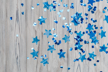 blue shiny stars on a wooden background abstraction. Abstract colorful background with blue...