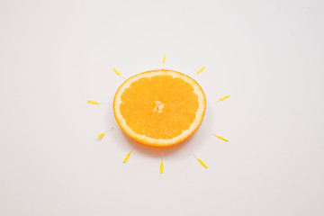 orange with petals surrounded of it like a flower