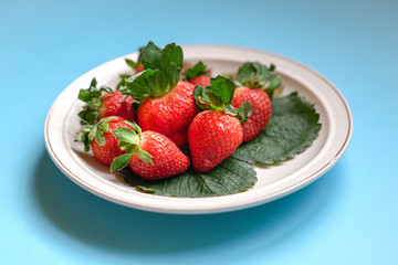 Juicy fresh strawberries on a plate