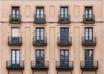 Abwaschbare Fototapete Windows and balconies in row on facade of historic building © dr_verner