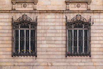 Fototapeta na wymiar Windows in row on facade of historic building