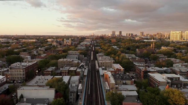 Subway Passing through Urban Neighborhood- 4k Aerial Cinematic