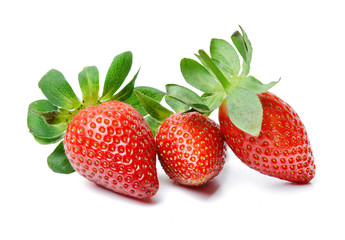 Three appetizing juicy strawberries on an isolated white background. Bright saturated colors. Close-up. Side view.