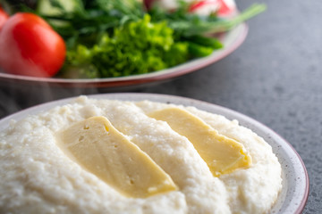 Mengrelian corn mamalica (ghomi) with cheese. Georgian food.
