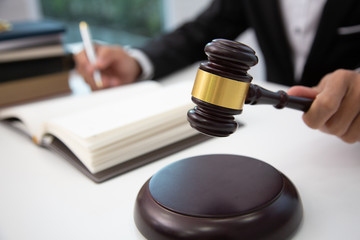 lawyer hand writes preparing the phrase to be used in the trial.concept of law