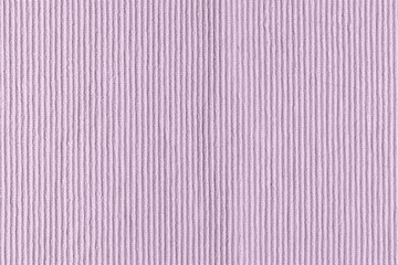 Sofa upholstery close-up. Texture of rough dense ribbed fabric. Lilac blank background for layouts.