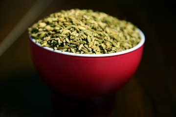 Fennel Seeds or Roasted saunf in a bowl, selective focus