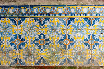 Tiles pattern of flowers with different colors like white, yellow and blue
