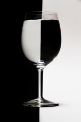 Empty wine glass on black and white background