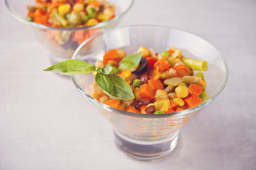 Homemade Mexican salad in a bowls withbeans, corn, tomato, pepper and other vegetables.
