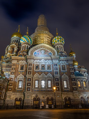 Fototapeta na wymiar The Church of the Savior on Spilled Blood, landmark in Saint Petersburg, view from front entrance, under twilight evening with night light in Russia