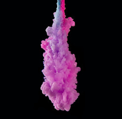 Coloured acrylic ink mixing in water on black