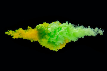 Coloured acrylic ink mixing in water on black
